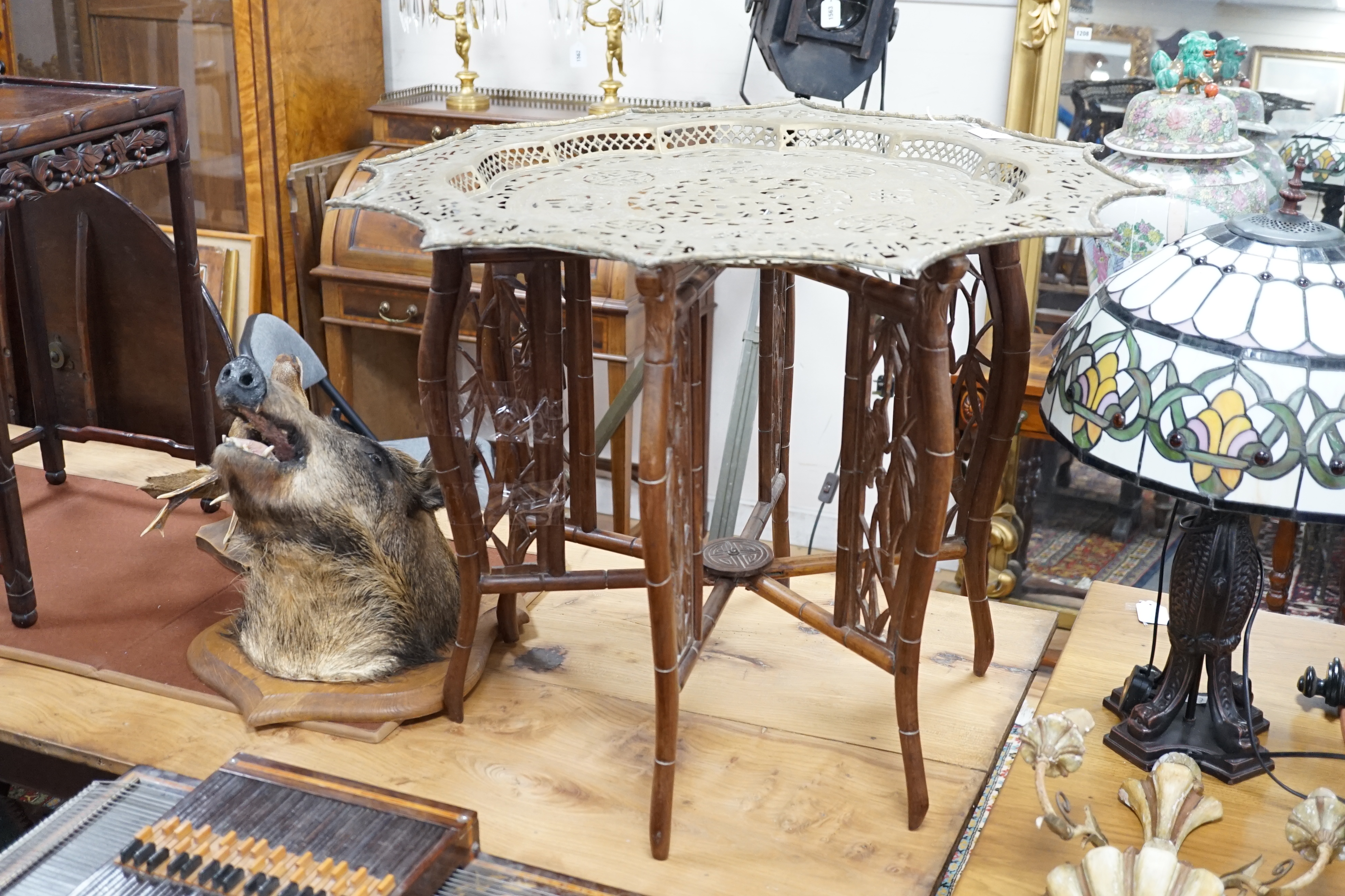 A Chinese circular fretted brass topped folding occasional table, diameter 82cm, height 62cm